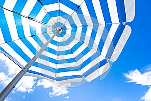 Striped beach umbrella photo