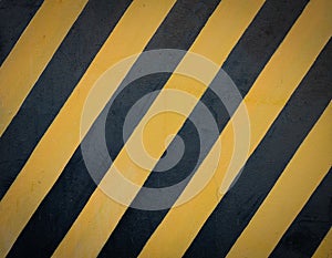Striped black and yellow grunge background