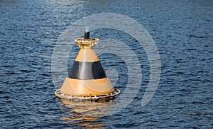 Striped buoy on the water