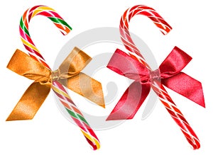 Striped candy cane with bow isolated over white, clipping path