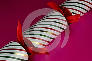 Striped Christmas Cracker on a Pink Surface