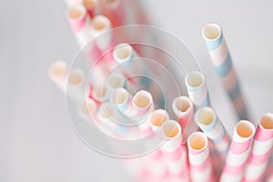 Striped cocktail straws in glass overhead view