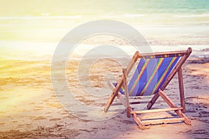 Striped deckchair at ocean sandy beach