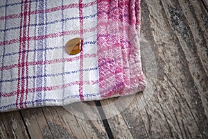 Striped dish cloth on brown wood