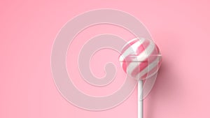 Striped fruit pink and white lollipop on stick on bright pink background with copy space