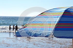 Striped parasol on the beach