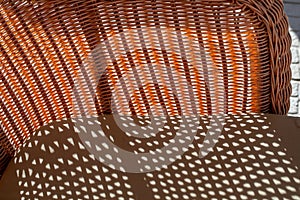Striped pattern and shadow of a bamboo chair