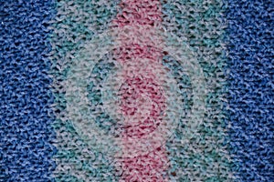 Striped pink and blue crocheted minimalist background. Hobby concept knitting or crocheting. Top view, web banner with