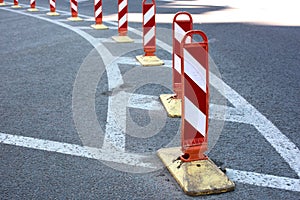 Striped road warning posts and road markings