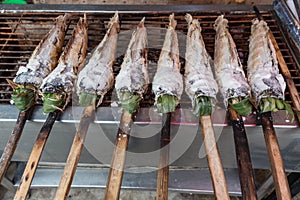 Striped snakehead fish grilled with salt. Pomegranate fish with salt and then burned for sales in the market. Thai style street f