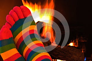 Striped socks by fireplace