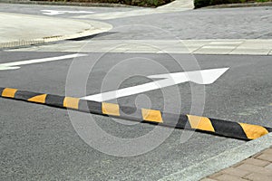 Striped speed bump on street. Road safety