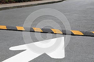 Striped speed bump on street. Road safety