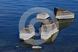 Striped stones in blue water