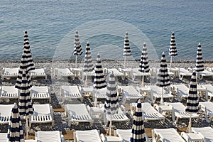 Striped umbrellas and beach chairs