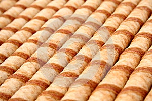 Striped wafer tubules with a chocolate cream photo