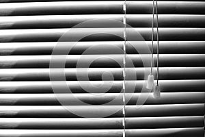 Striped window shuttering in light and shadow lines horizontal