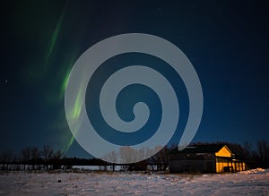 Stripes of aurora borealis in night sky