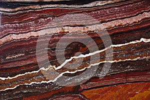 Stripes on the background of natural Onyx stone, red color, Onice Fantastico photo