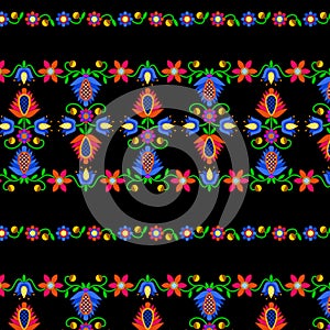 Stripes of multicolored floral ornament in folk style on a black background. Seamless patterns