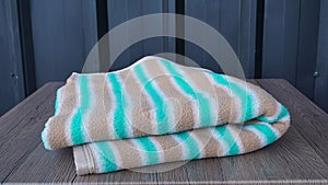 Stripes warm blanket isolated on the table