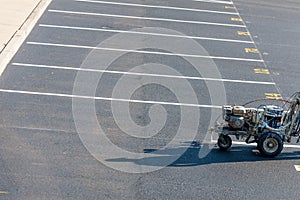 Striping machine on the parking lot