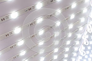 Strips of 12 volt poxy LED modules lights on display at an electronics store. An array of light emitting diodes strips