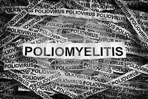 Strips of newspaper with the words Poliomyelitis and Poliovirus typed on them