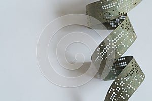 Strips of old punched tape on a white surface