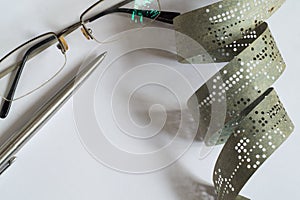 Strips of old punched tape on a white surface