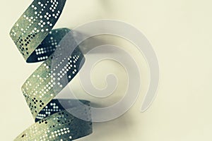 Strips of old punched tape on a white surface