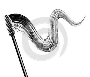 Stroke of black mascara with applicator brush close-up