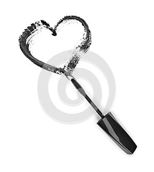 Stroke of black mascara in the form of heart with applicator brush