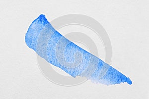 Stroke of blue watercolor paint on white background, top view