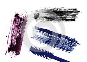 Stroke (sample) of blue, violet and black mascara, isolated