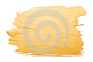 Strokes of golden paint brush close up isolated on white background