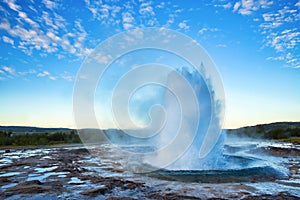 Strokkur Geysir Eruption with Bright Blue Sky, Iceland