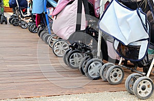 Strollers parked on the parquet floor