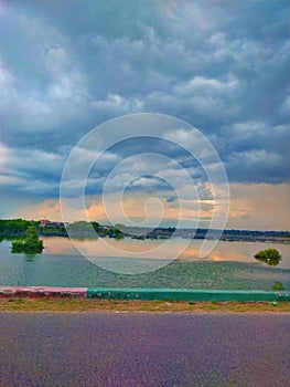 Strom clouds gethering over serene waters photo