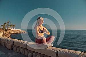 Strong active female training by the waterfront