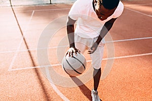 Strong African young sports people in the stadium in the open air to play basketball