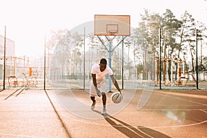 Strong African young sports people in the stadium in the open air to play basketball