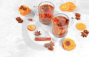 Strong alcoholic or non-alcoholic cocktail, mulled wine with spices, star anise, cranberry and cinnamon, warming winter drink