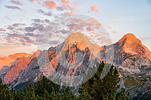 Strong alp glow at sunrise in the alps looks like mountains are on fire