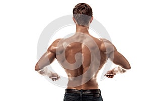 Strong Athletic Man Fitness Model posing back muscles, triceps over white background. Copy space