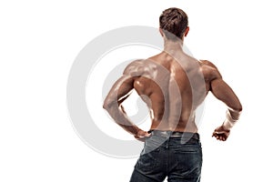 Strong Athletic Man Fitness Model posing back muscles, triceps over white background. Copy space