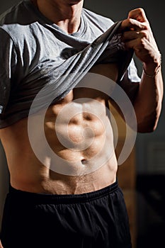 Strong Athletic Man Fitness Model Torso showing six pack abs