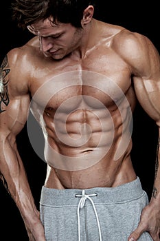 Strong Athletic Man Fitness Model Torso showing six pack abs.