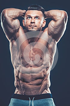 Strong Athletic Man Fitness Model Torso showing six pack abs. is