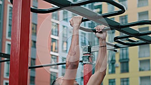 Strong athletic sportsman latina african american man bodybuilder doing intense workout on horizontal bar pull-ups sport